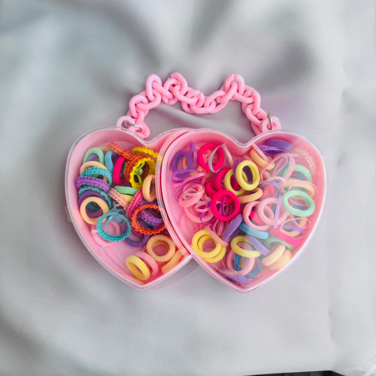 Hair ties in a heart shape box