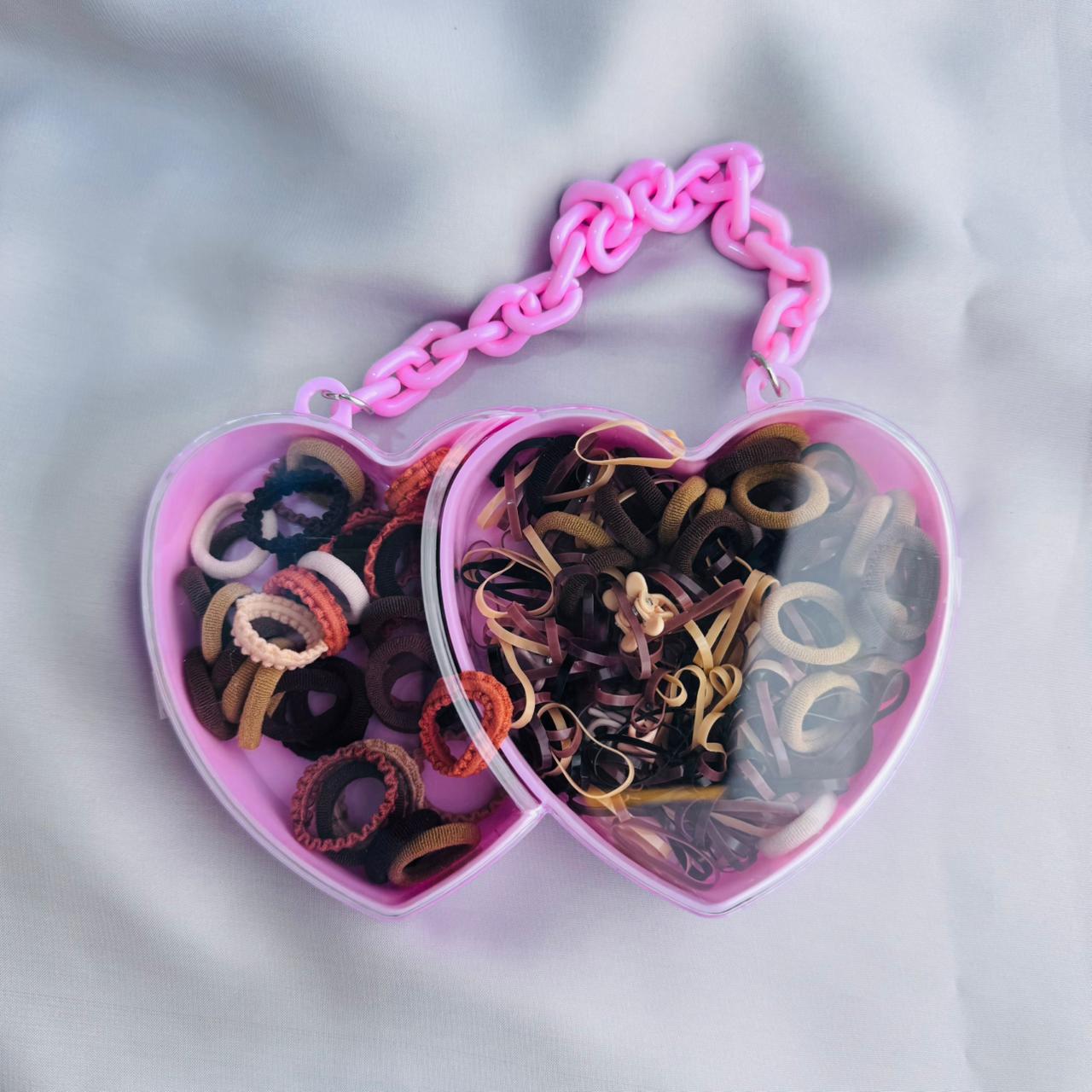 Hair ties in a heart shape box